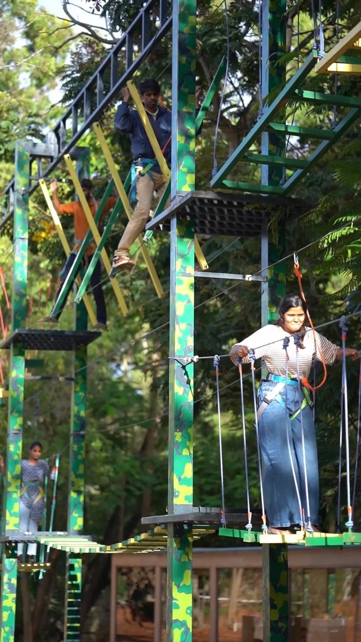 A guest on the high ropes course in the adventure zone