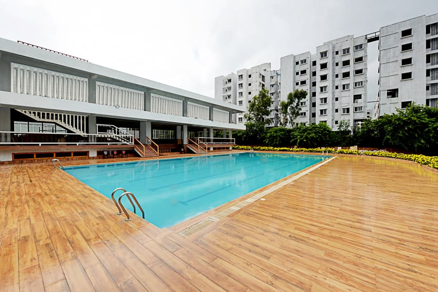 The swimming pool along its full length beside the clubhouse