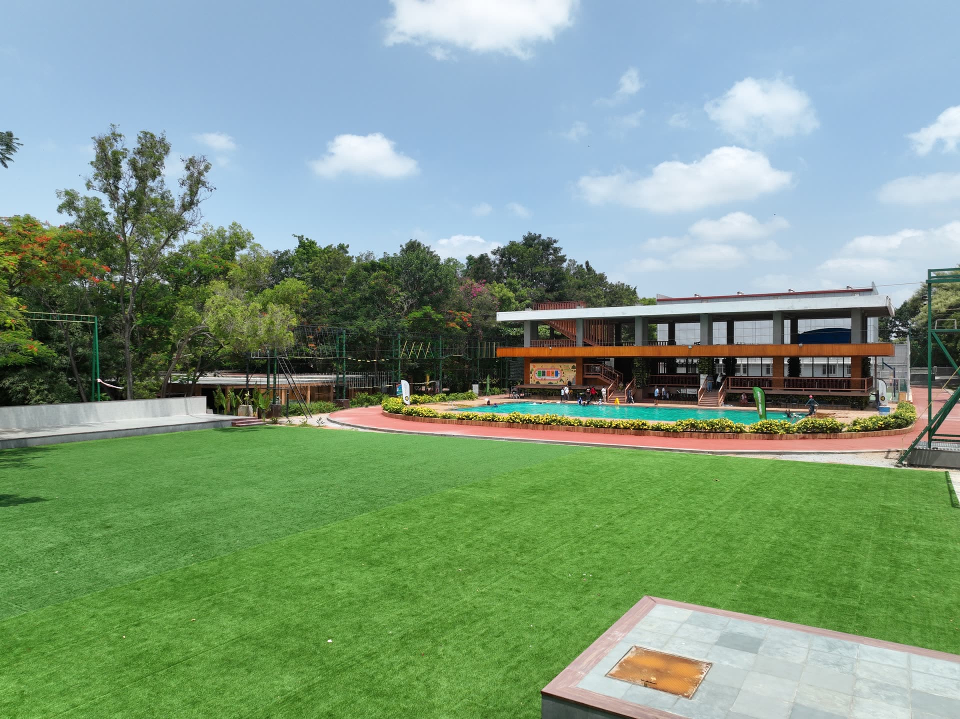 The great lawn, pool and clubhouse from the air — one of the pre-wedding photoshoot locations at Gold Coins Club & Resort