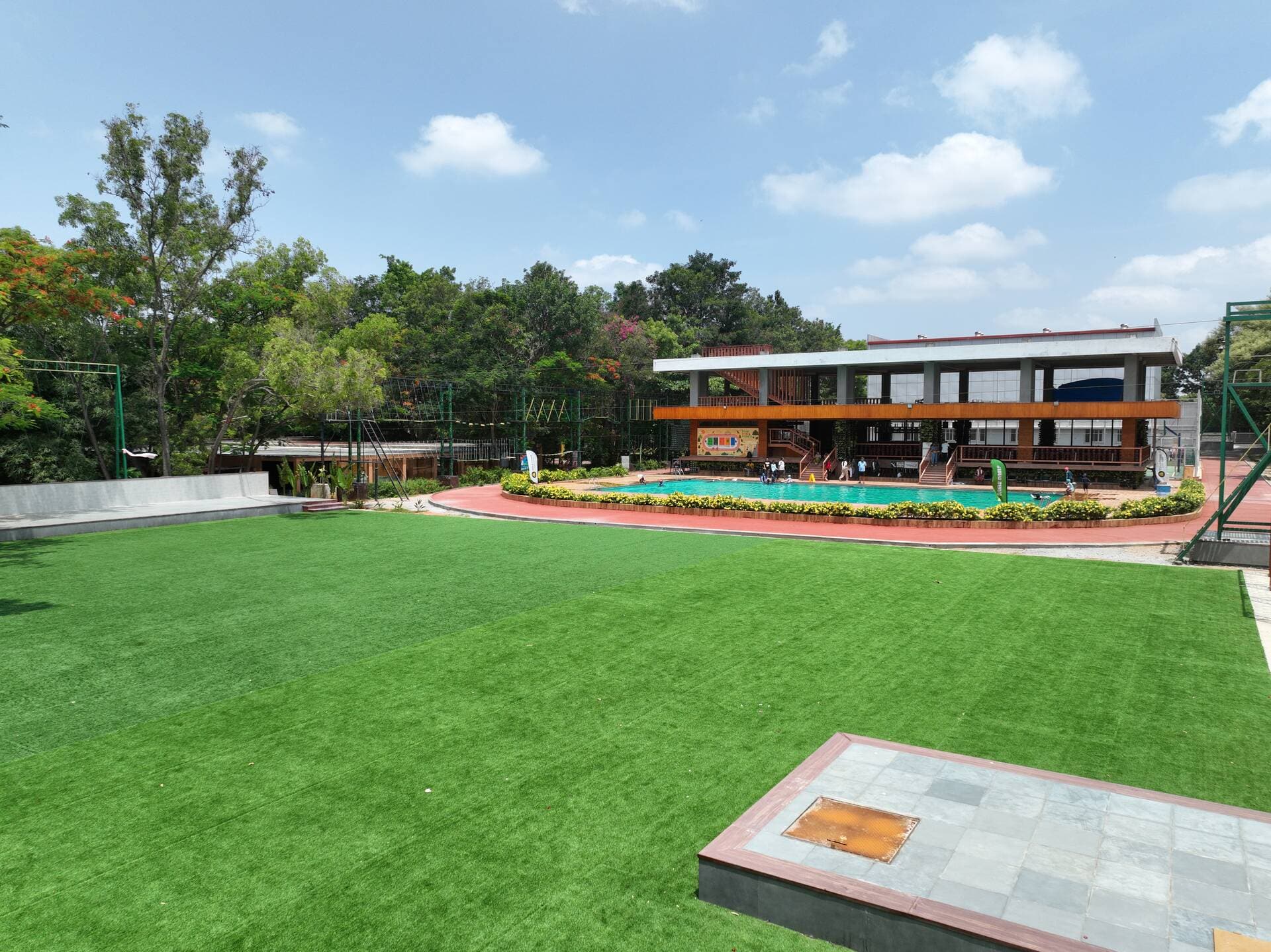 Aerial view of the resort showing the main lawn, banquet hall, pool and patio lawn together
