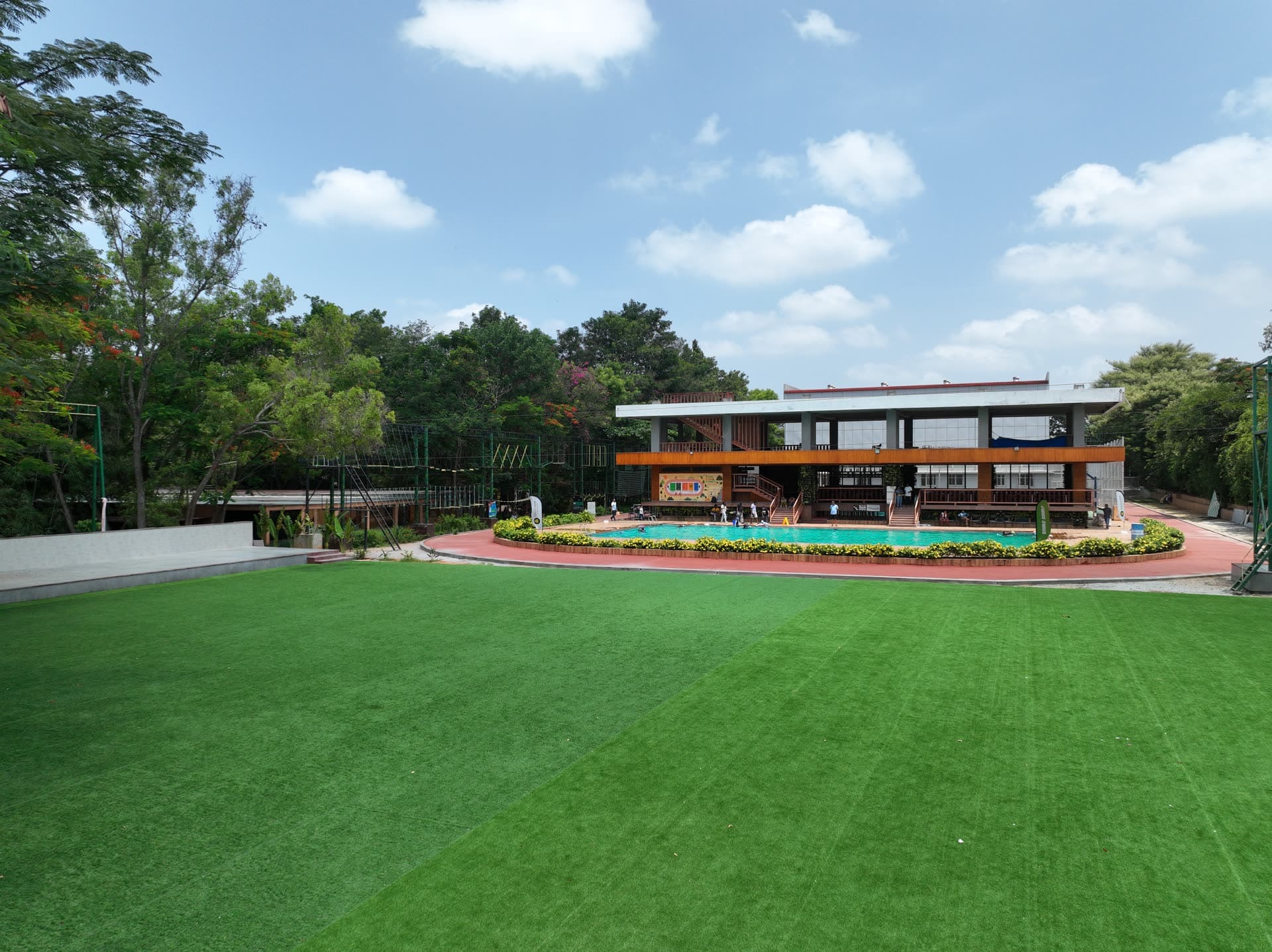 Aerial view of the pool, lawn and clubhouse at Gold Coins Club & Resort