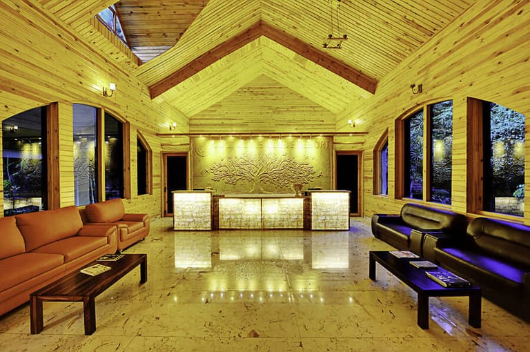 Reception desk at Gold Coins Club & Resort with a guest checking in