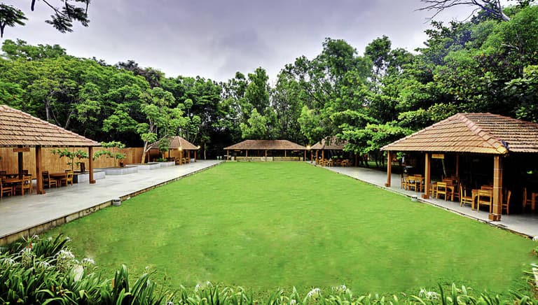 Wide view across the resort lawns in morning light