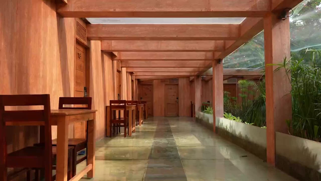 The water court dining corridor with tables set alongside the koi channel